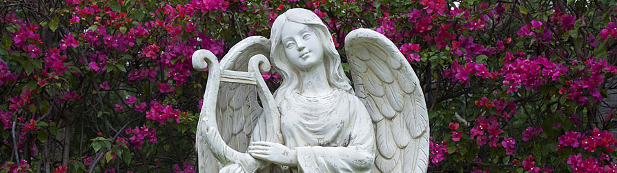 Statue of an angel playing a harp