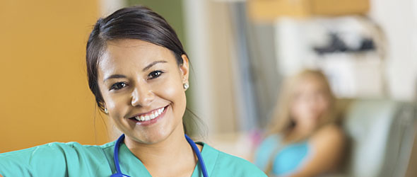 Young female nurse smiling at camera