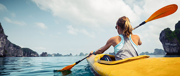 Young lady in Kayak on river